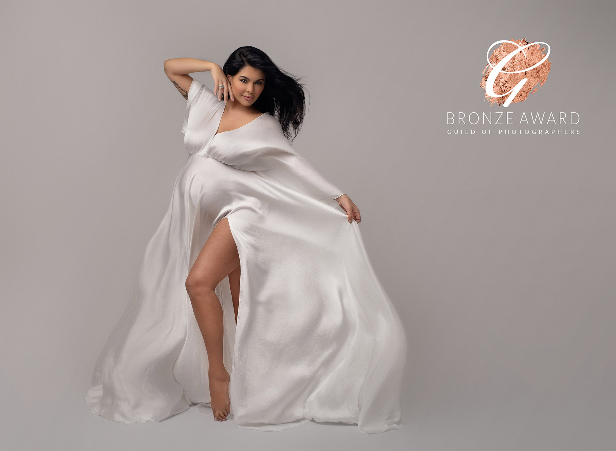 beautiful pregnant lady in flowing white dress