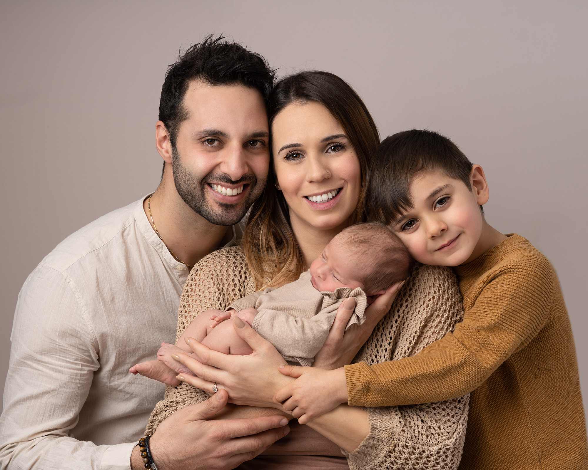 family portrait photograph with newborn baby by newborn photographer in Guildford, Surrey