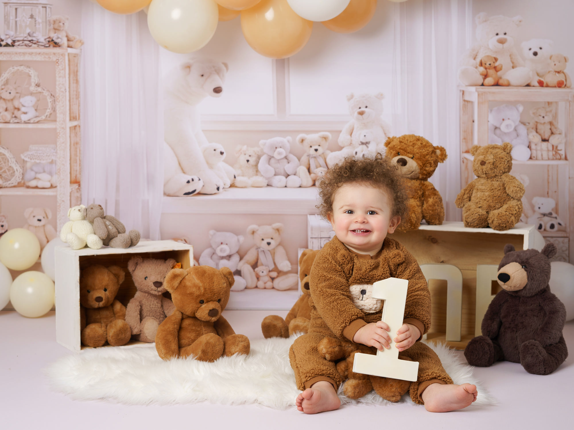 baby boy in a bear costume by CAKE SMASH PHOTOGRAPHER SURREY